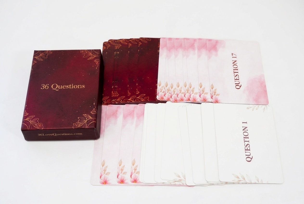 36 Questions card game box with deck of cards spread out — a tool for couples conversation